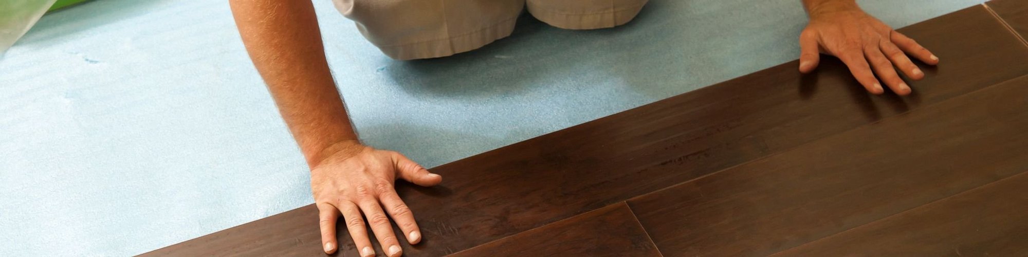 person installing flooring products from Kenny's Custom Flooring Inc. in San Marcos, CA
