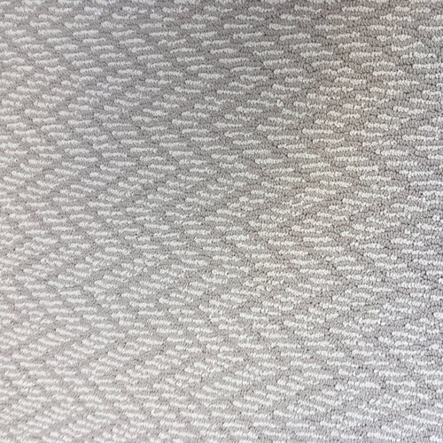 striped white and beige carpet with a zig-zag pattern