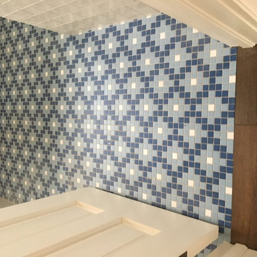 room with mosaic tile flooring
